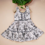 Premium cotton casual gathering frock with cute cartoon print and tiered flare, perfect for outdoor look and daily wear for girls aged 1–4 years.