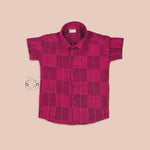 Bright magenta silk shirt with golden check patterns folded neatly – premium traditional shirt for boys by Boon Babies, Coimbatore.