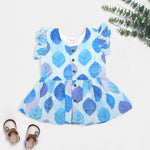 Baby girls hakoba frill frock in blue leaf print (NB–24M). Soft cotton with frill sleeves & button closure – stylish festive & casual outfit.