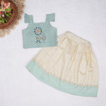 Mint green embroidered cotton top with cream skirt, elastic waist and lining โ elegant Kerala-style ethnic wear for girls aged 1โ5 years.