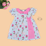 Grey cotton puff frock with pink collar, waist bow & lotus cow print. Cute & comfy for baby girls aged 6M–4Y.