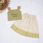 Olive green embroidered cotton top with cream skirt, elastic waist and soft lining โ elegant Kerala-style ethnic wear for girls aged 1โ5 years.