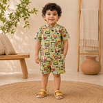 Boy's co-ord set by Boon Babies with olive truck print, includes a Chinese collar shirt and matching shorts.