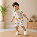 Baby wearing Jaipur Cotton multi-animal print shirt and matching shorts from Boon Babies, featuring a straight collar for summer wear.