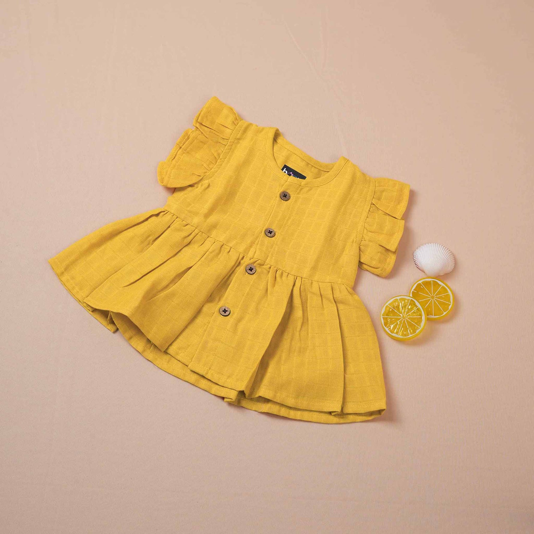 Mustard Muslin Baby Frock – Soft & Stylish with Wooden Buttons Boon Babies