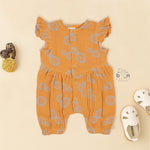 Crinkled muslin baby romper in rust orange with spiral print, flutter sleeves, and snap-down front – soft summer outfit for babies from Boon Babies, Coimbatore.