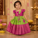 Beautiful green and pink tissue silk Pattu Pavadai for girls, elegant ethnic frock by Boon Babies with intricate details.