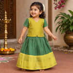 Girls green ethnic top and skirt set with cotton lining from Boon Babies, featuring traditional patterns and comfortable fabric.