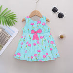 Adorable sleeveless cotton frock with pink lotus prints & bow. Ages 1–4 years. Comfortable, stylish & perfect for festive and casual occasions.