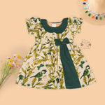 Nature-inspired bird print cotton Side Pleated Frock with green collar & bow. Ages 6M–4Y. Soft, breathable & stylish everyday festive wear.