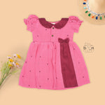 Pink Side Pleated Frock maroon collar & bow detailing. Sizes 6M–4Y. Perfect blend of comfort & festive charm for baby girls.
