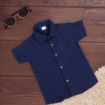 Navy diamond check boys' printed cotton shirt with straight collar, from Boon Babies, suitable for ages 6-12 months.
