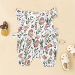 Cotton baby romper with colorful botanical and bird print, flutter sleeves, side bows, and front snap buttons – from Boon Babies, Coimbatore.