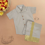 Silver silk shirt & dhoti set with golden zari border for boys aged 6M–5Y. Ideal festive wear for Onam & celebrations.