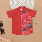 Rust red floral panel silk shirt with cream pattu dhoti for boys, ethnic wear by Booon Babies, perfect for special occasions.