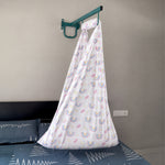 Printed newborn baby cotton cradle with white rainbow design by Boon Babies, showcasing soft fabric and cozy sleeping area.