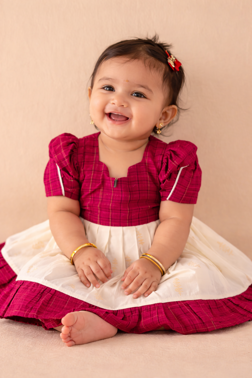 Traditional Kerala cotton baby frock with a soft pleated skirt and festive blouse, designed for comfort, elegance, and everyday celebrations.