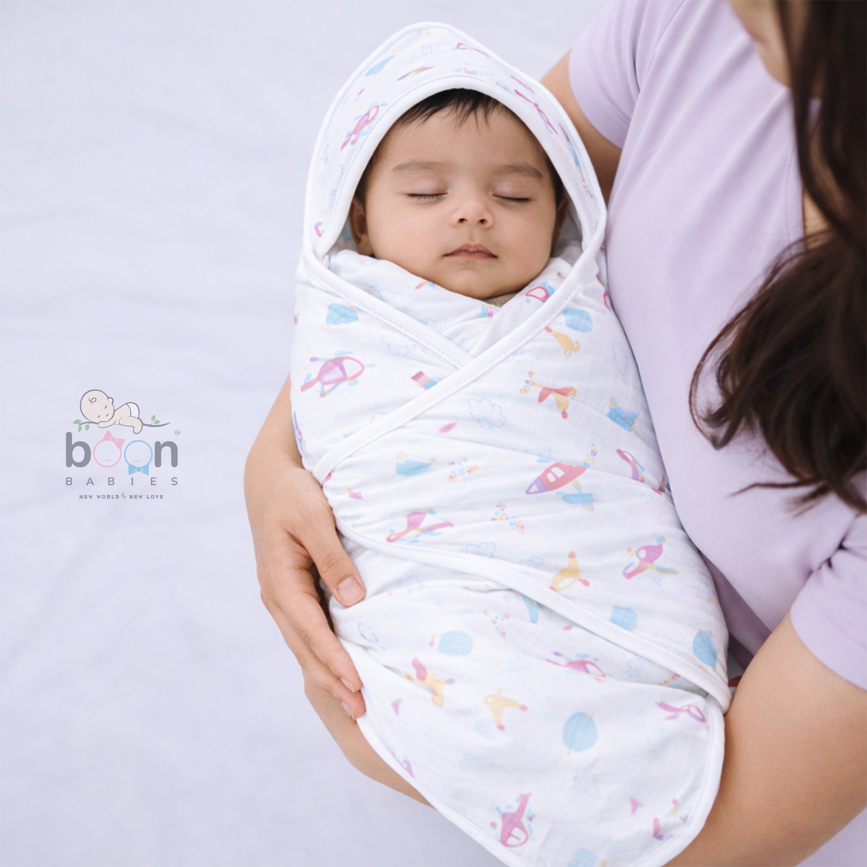 Boonbabies printed 2-layer muslin hooded baby towel with soft fabric and cute print, measuring 70x70 cm, for newborns.