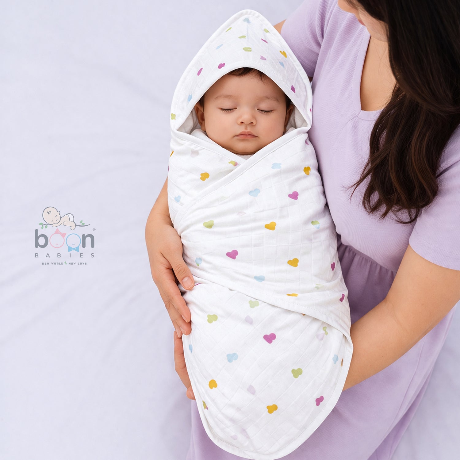 Boonbabies printed 2-layer muslin hooded baby towel with soft, colorful print, measuring 70x70 cm, ideal for newborns.