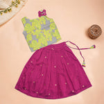 Girls leaf printed ethnic top and magenta pleated skirt set by Boon Babies, featuring a leafy patterned top and vibrant pink skirt.