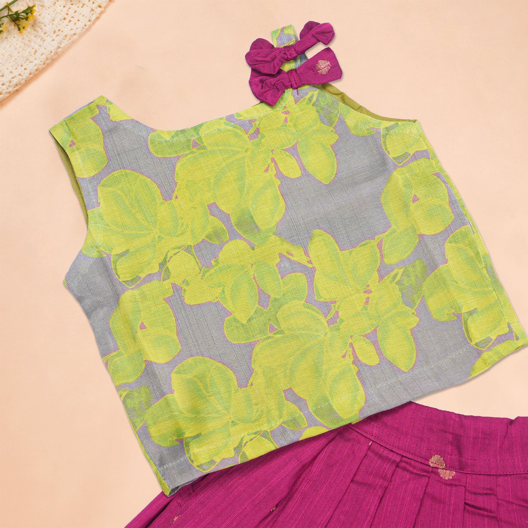Girls leaf printed ethnic top and magenta pleated skirt set from Boon Babies, featuring a stylish, colorful design.