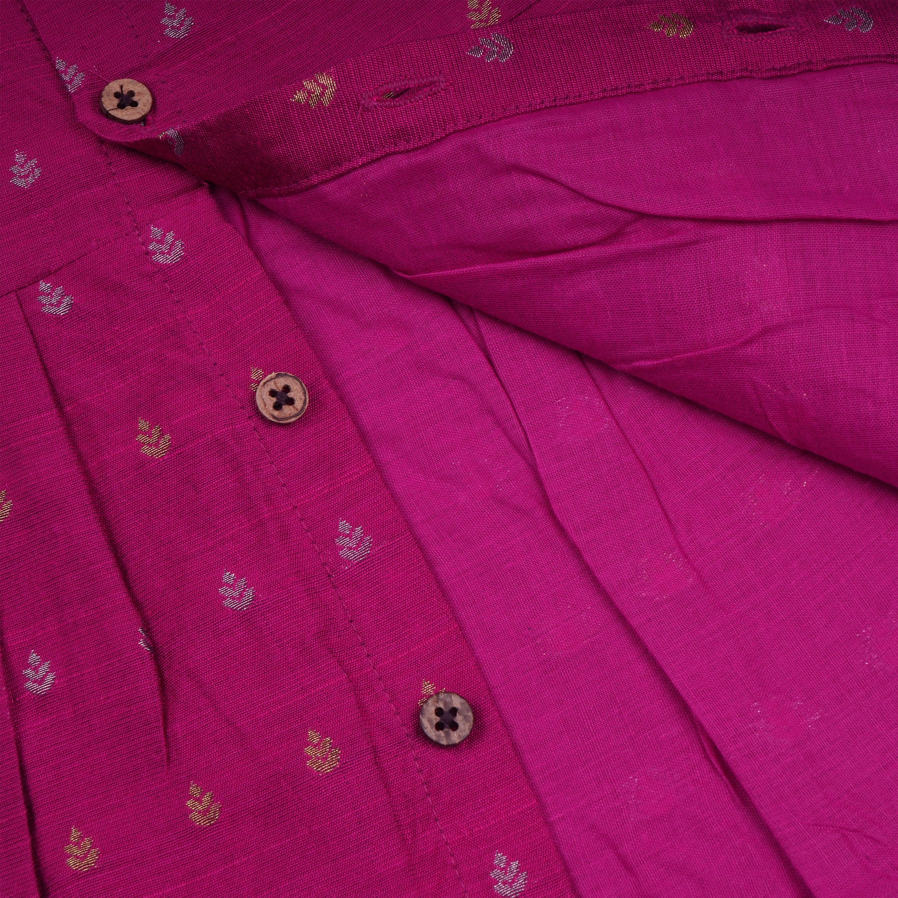 Baby girl in a Magenta Pink ethnic sleeveless frock by Boon Babies, showcasing the dress's vibrant color and traditional style.