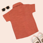 Boys cotton printed straight collar shirt in burnt orange with casual style from Boon Babies, shown in the front view.