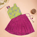 Girls leaf printed ethnic top and magenta pleated skirt set by Boon Babies, featuring a leafy print top and vibrant pleated skirt.