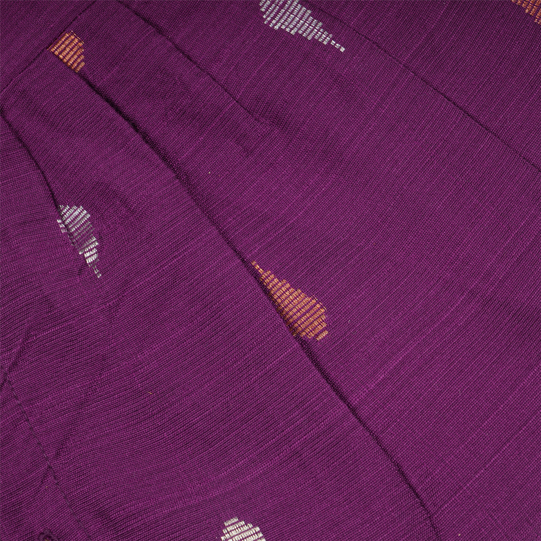 Baby girl wearing a purple Boon Babies ethnic sleeveless frock, featuring traditional embroidery and comfortable fabric.