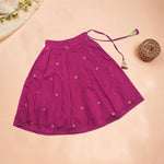 Girls leaf printed ethnic top and magenta pleated skirt set by Boon Babies, featuring a leaf pattern on the top and a vibrant pleated skirt.