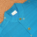 Boy wearing a sky blue silk butta traditional shirt and dhoti set by Booon Babies, perfect for festive ethnic celebrations.