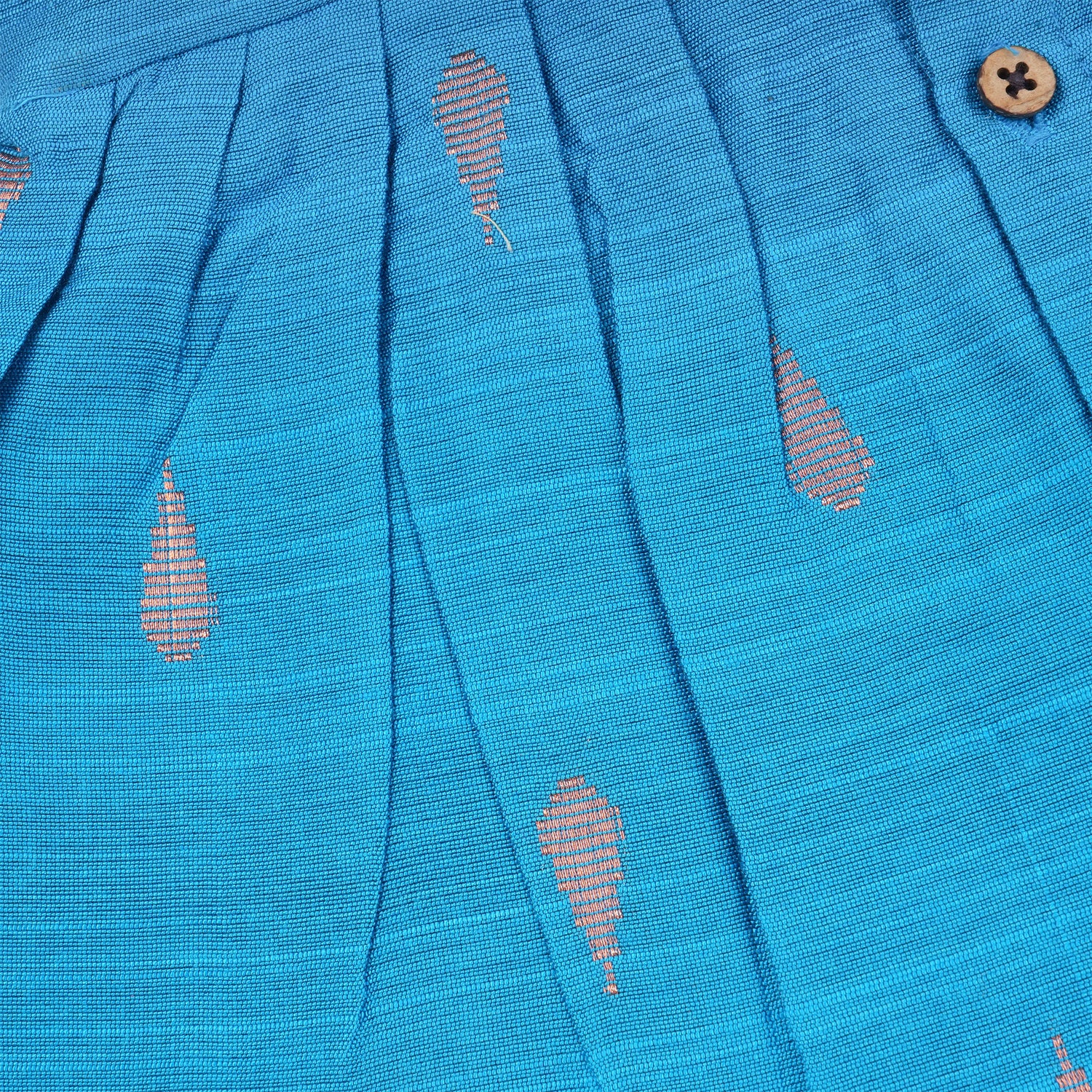 Baby girl in a blue ethnic sleeveless frock by Boon Babies, showcasing traditional style and soft fabric for special occasions.