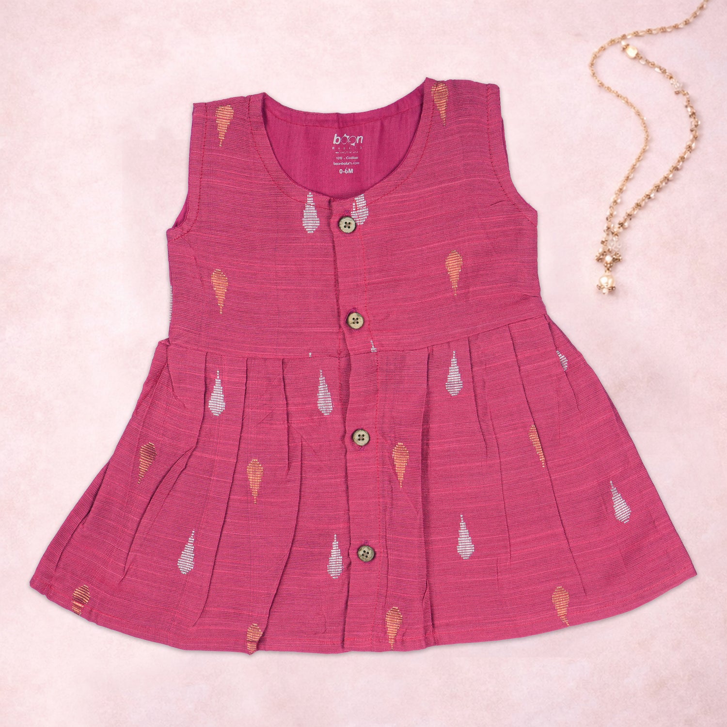 Pink ethnic sleeveless frock for baby girls by Boon Babies, featuring traditional design and comfortable fit.