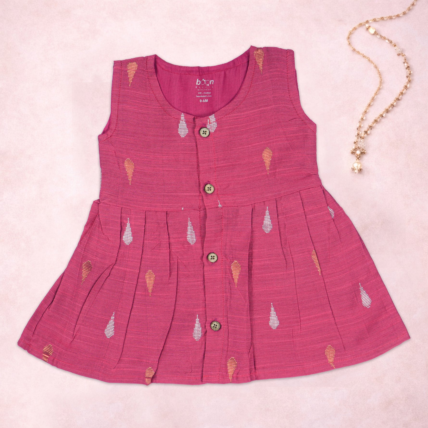 Pink ethnic sleeveless frock for baby girls by Boon Babies, featuring traditional design and comfortable fit.