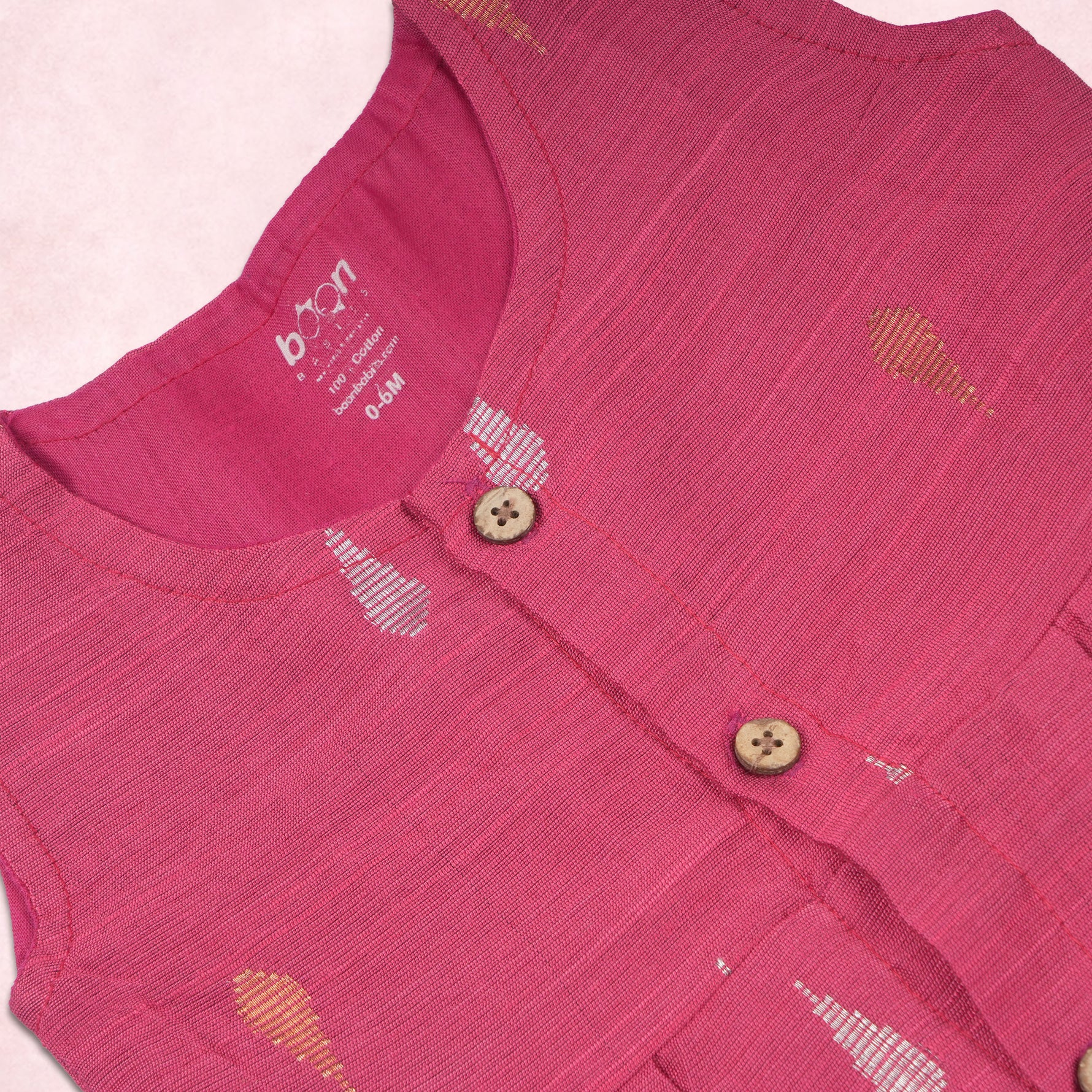 Pink ethnic sleeveless baby girl frock by Boon Babies, featuring traditional design and soft fabric for special occasions.