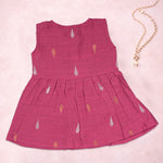 Baby girl wearing a pink ethnic sleeveless frock by Boon Babies, featuring intricate traditional embroidery and comfortable fabric.