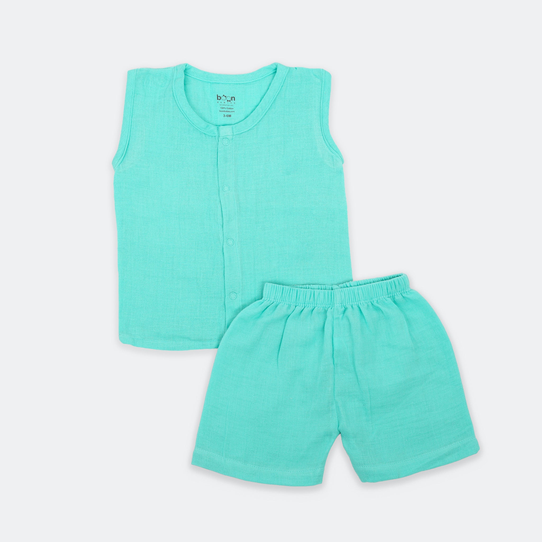 Baby wearing a crinkled muslin jabla and shorts set by Boon Babies, showcasing the soft, solid fabric and comfortable fit.