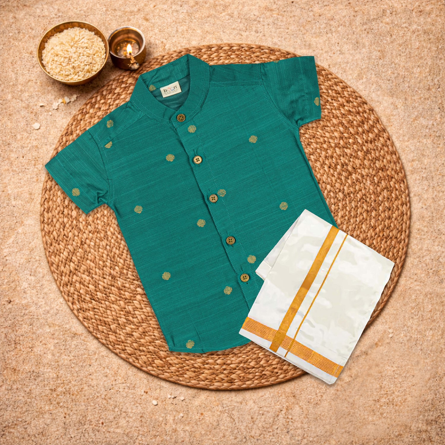 Boys bottle green silk butta shirt and dhoti set by Booon Babies, traditional ethnic wear with elegant design.