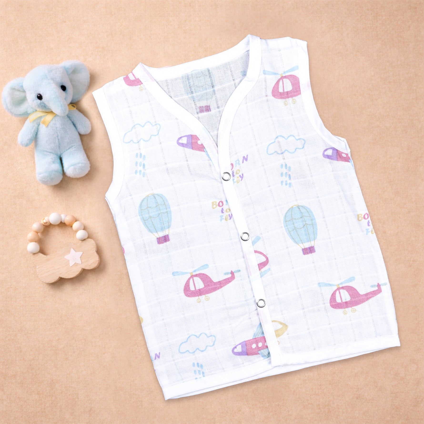 Soft, breathable printed sleeveless muslin jabla for babies 0-12 months by Boon Babies, featuring colorful baby-friendly prints.