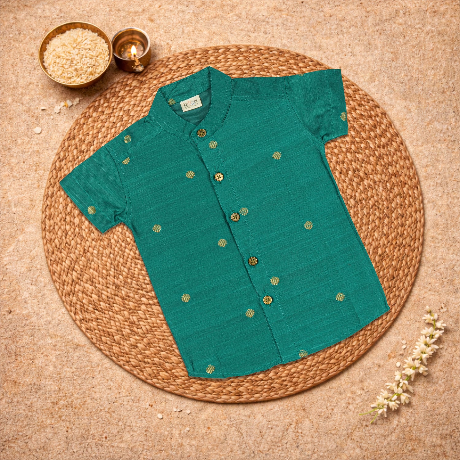 Boys bottle green silk butta shirt and dhoti set by Booon Babies, traditional ethnic wear for boys, with intricate design details.