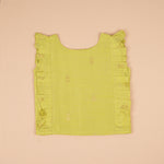 Soft silk sleeveless top and flared skirt set for girls with a classic ethnic look, ideal for festive and outdoor wear.