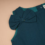 Girls teal green sleeveless co-ord set with matching pants by Boon Babies, shown in a casual outdoor setting.