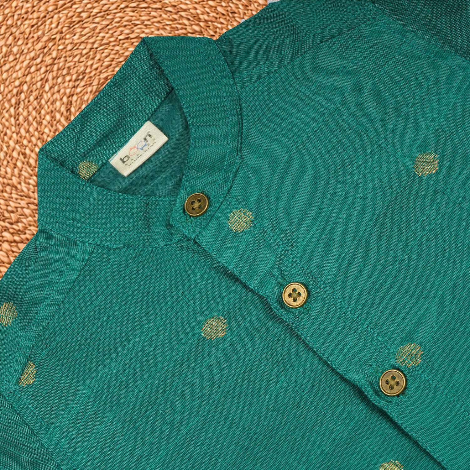 Boys bottle green silk butta shirt and dhoti set by Booon Babies, traditional ethnic wear, front view with intricate design details.