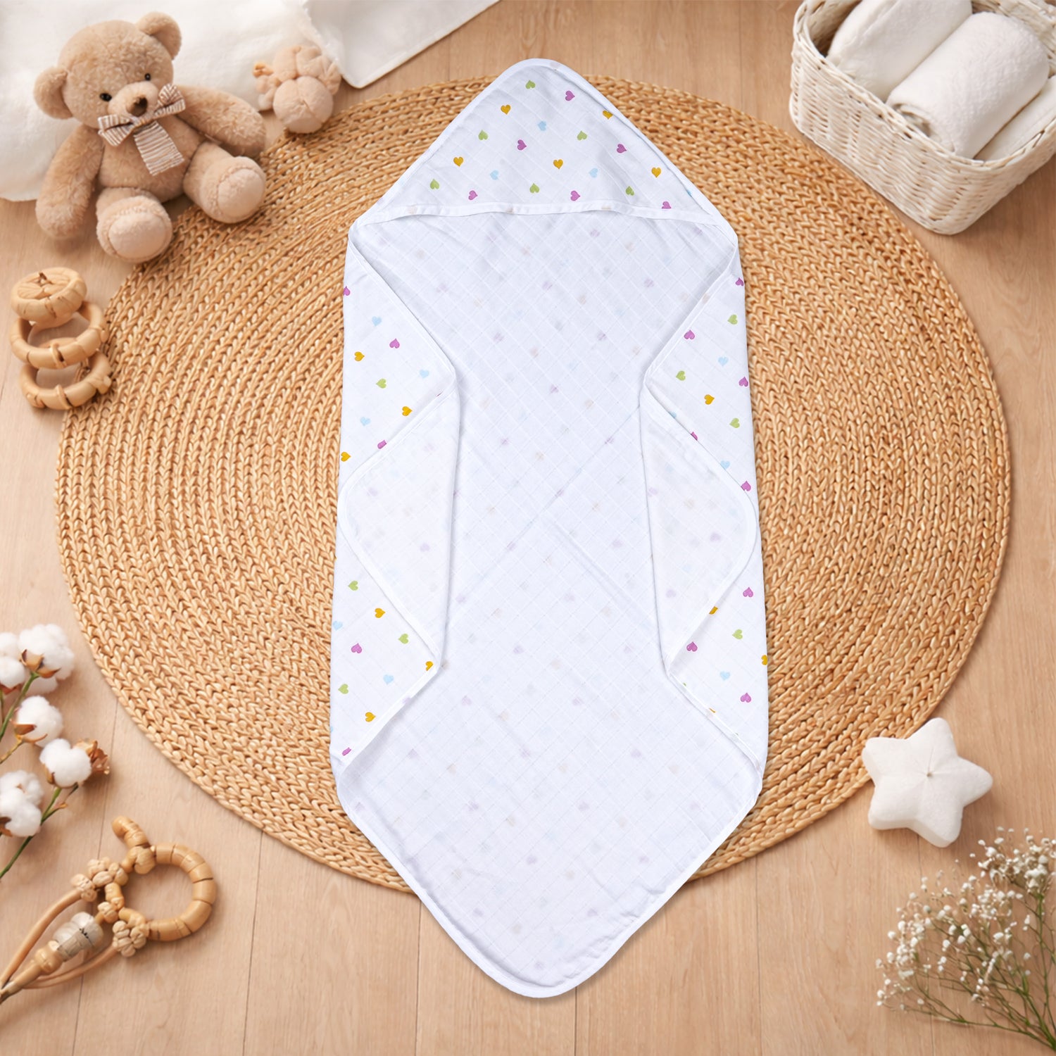 Boonbabies printed hooded muslin baby towel with two layers, soft and absorbent, featuring a colorful print for newborns.