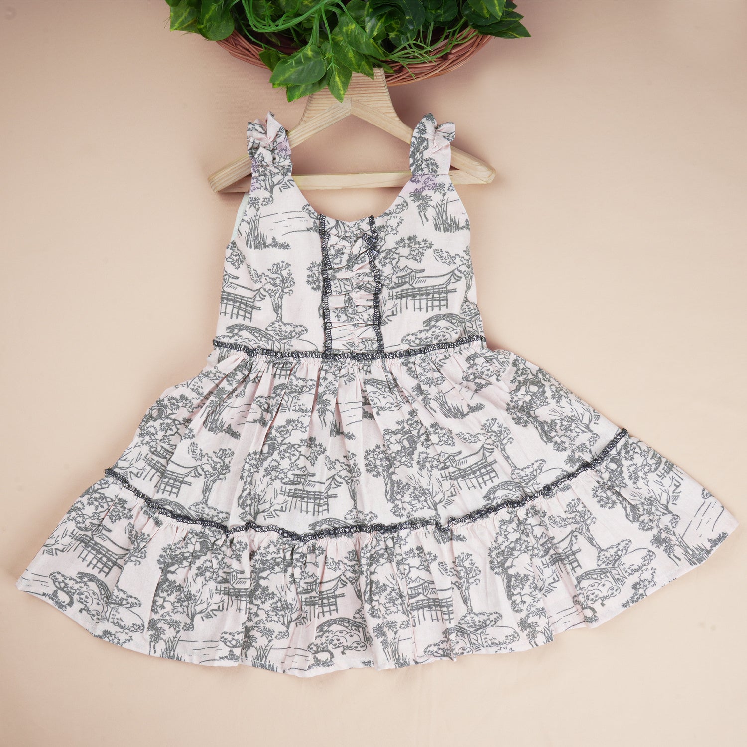Premium cotton casual gathering frock with scenic print and layered flare, perfect for outdoor look and daily wear for girls aged 1–4 years.