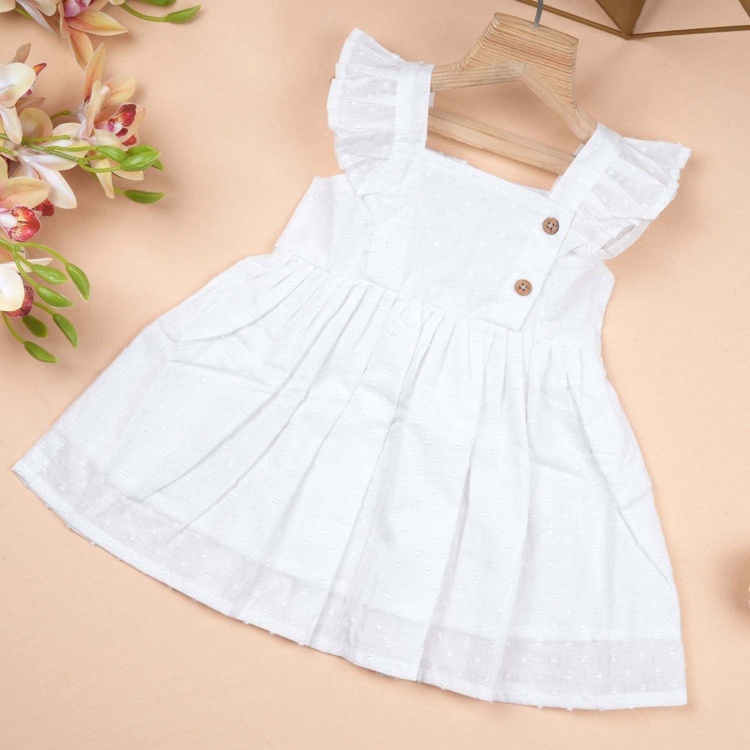 Boonbabies girls solid frill cotton baby dress in soft twill, featuring a casual style with ruffled details for ages 6 months to 5 years.