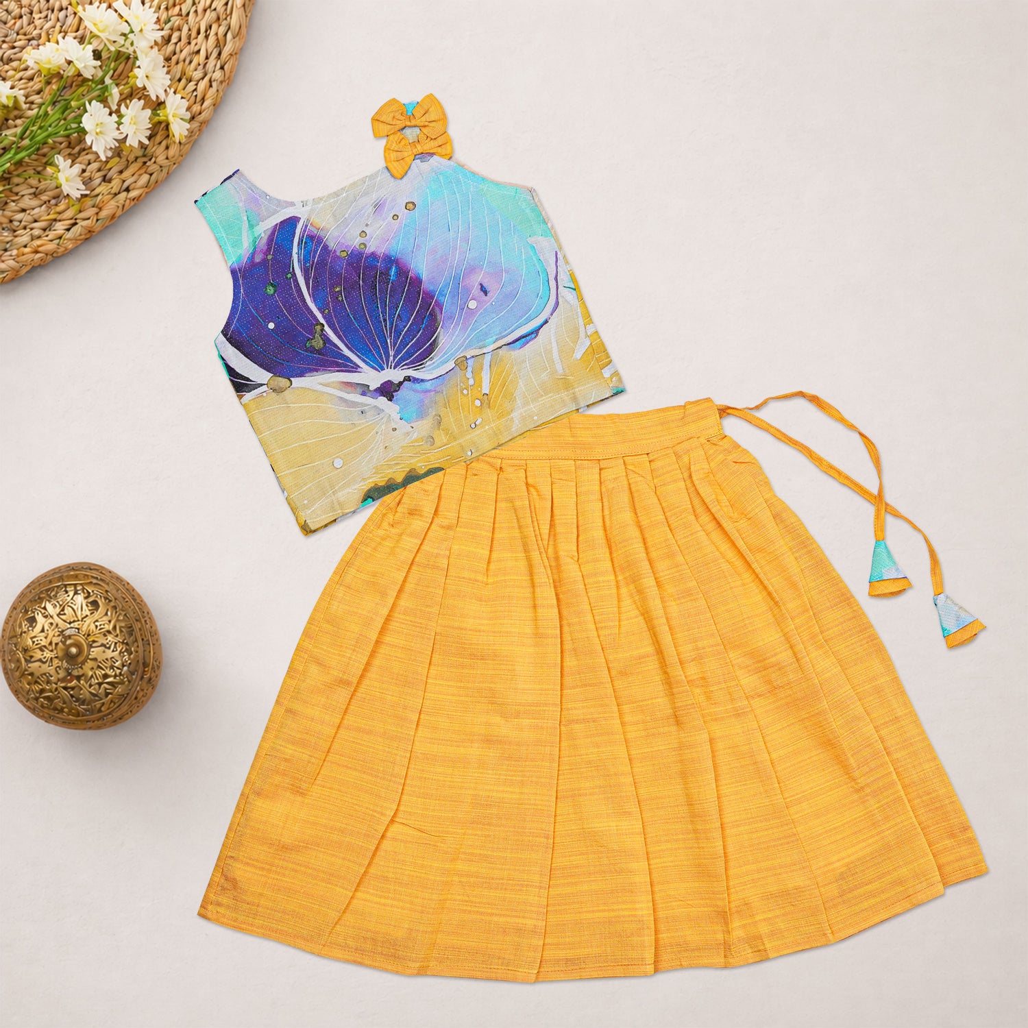 Girls floral printed ethnic top and mustard pleated skirt set by Boon Babies, featuring colorful floral patterns and pleated fabric.