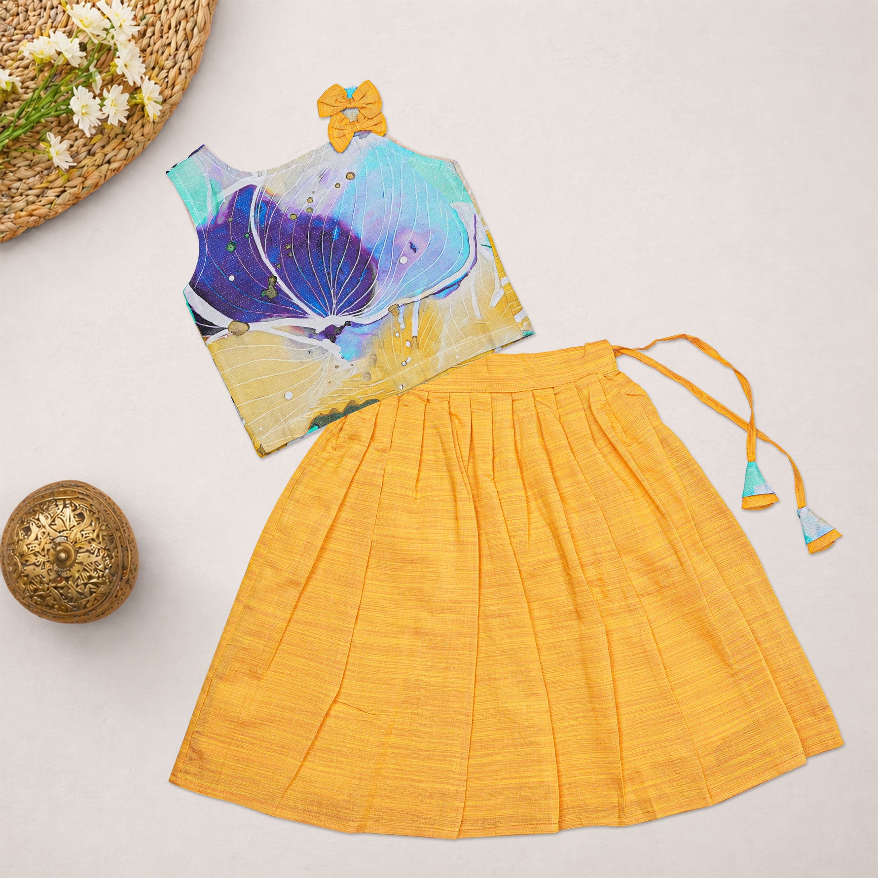 Girls floral printed ethnic top and mustard pleated skirt set by Boon Babies, featuring colorful floral patterns and pleated fabric.