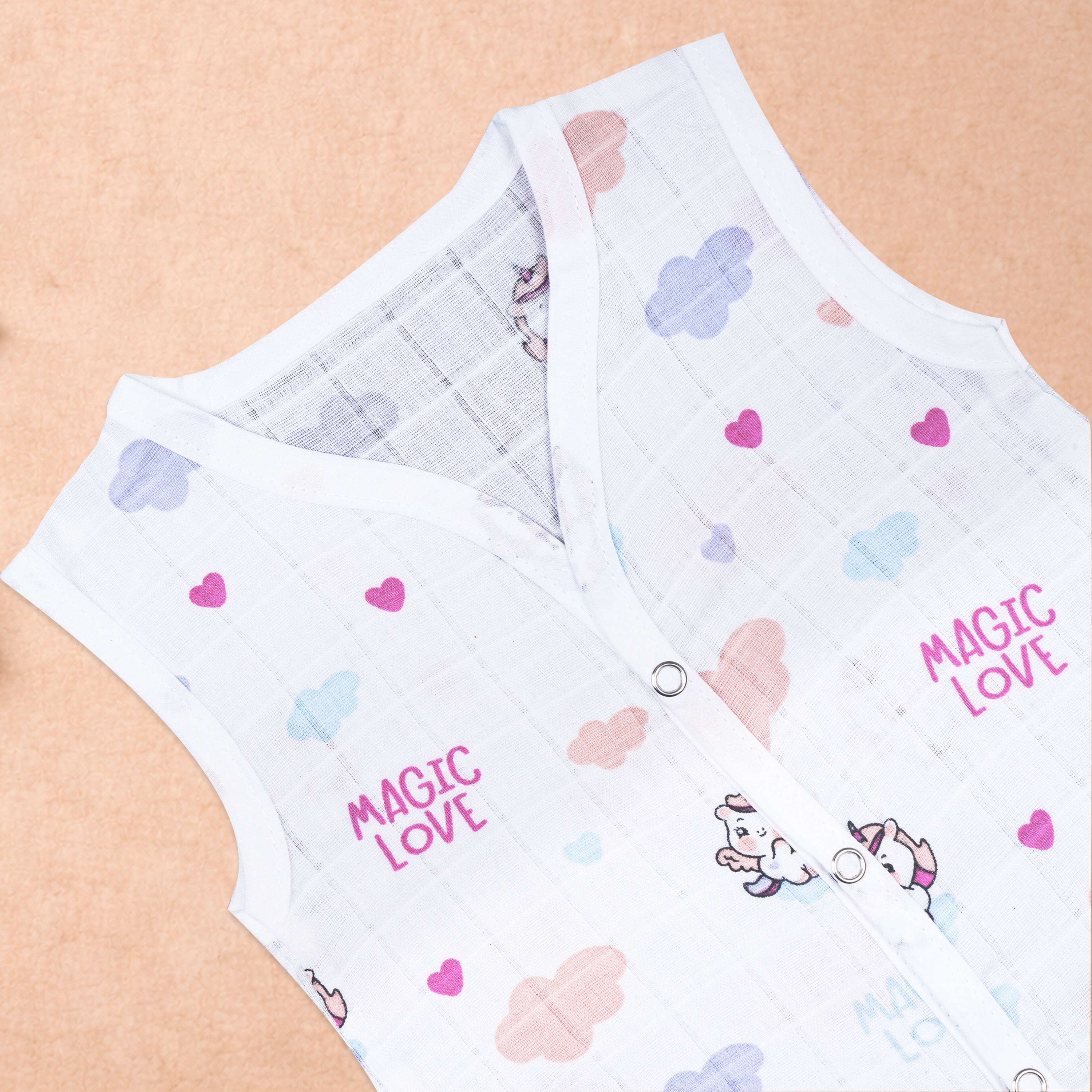 Soft, breathable printed sleeveless muslin jabla for babies 0-12 months by Boon Babies, featuring colorful print and lightweight fabric.