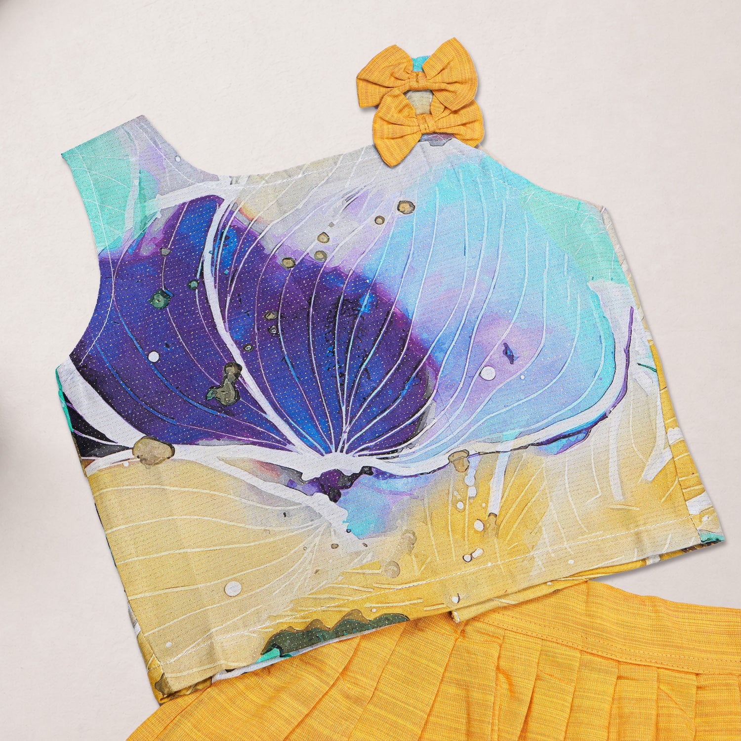 Girls floral printed ethnic top and mustard pleated skirt set by Boon Babies, featuring colorful floral design on the top and pleated skirt.